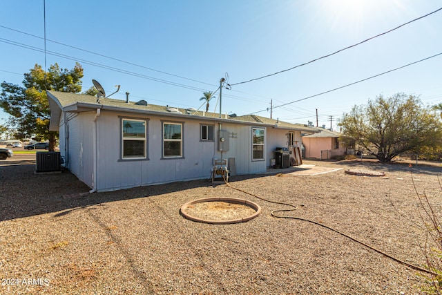 back of house featuring cooling unit