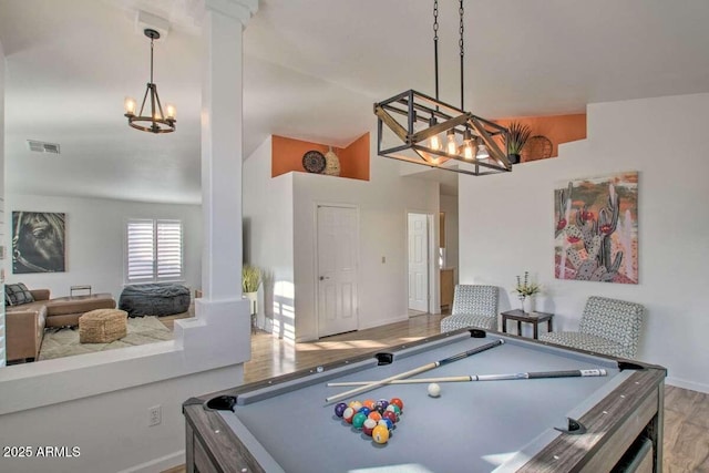 recreation room featuring a notable chandelier, pool table, and light hardwood / wood-style floors