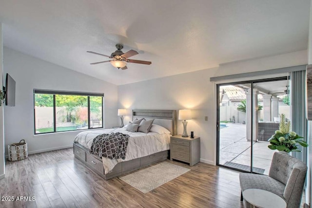 bedroom featuring vaulted ceiling, access to outside, ceiling fan, and light hardwood / wood-style floors