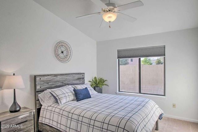 bedroom with vaulted ceiling, carpet floors, and ceiling fan