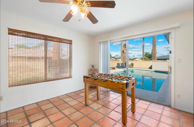 playroom featuring tile patterned flooring and ceiling fan