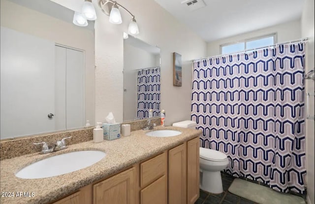 bathroom with a shower with curtain, vanity, and toilet