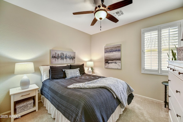 bedroom with ceiling fan and light colored carpet