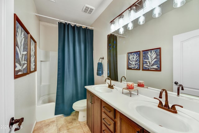 full bathroom featuring vanity, toilet, tile patterned flooring, and shower / bath combo