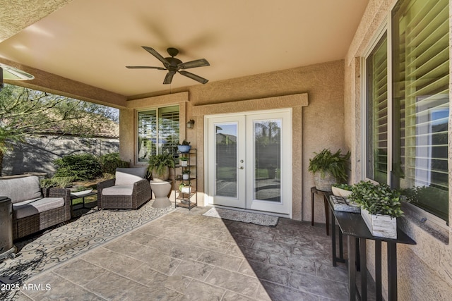 view of patio / terrace featuring french doors, ceiling fan, and outdoor lounge area