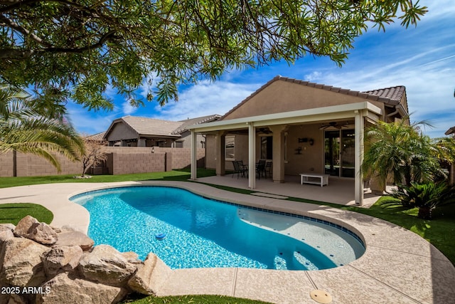 view of swimming pool featuring a fenced backyard, a ceiling fan, a fenced in pool, and a patio