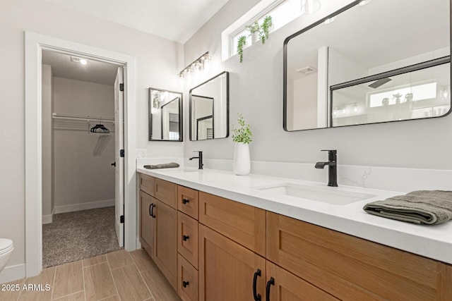33287 N Windmill Run, San Tan Valley, AZ 85144 - full bath featuring double vanity, toilet, a spacious closet, wood tiled floors, and a shower