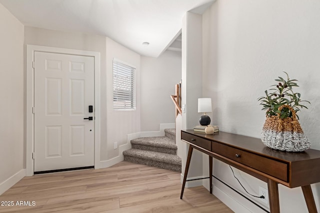 33287 N Windmill Run, San Tan Valley, AZ 85144 - foyer entrance featuring light wood-style floors, stairway, and baseboards