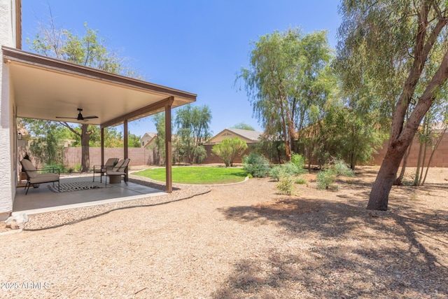 33287 N Windmill Run, San Tan Valley, AZ 85144 - fenced backyard featuring a ceiling fan and a patio