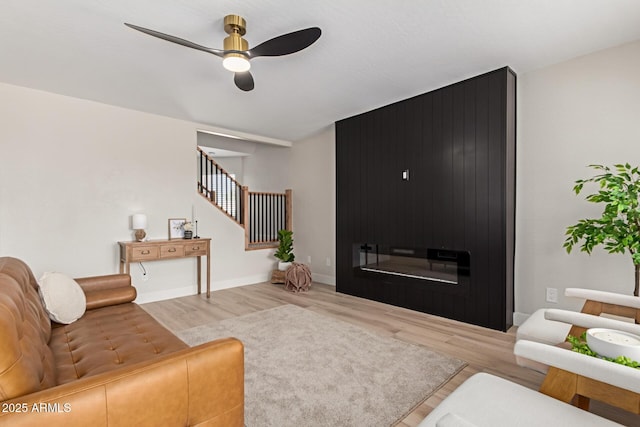 33287 N Windmill Run, San Tan Valley, AZ 85144 - living area featuring wood finished floors, stairs, ceiling fan, and baseboards