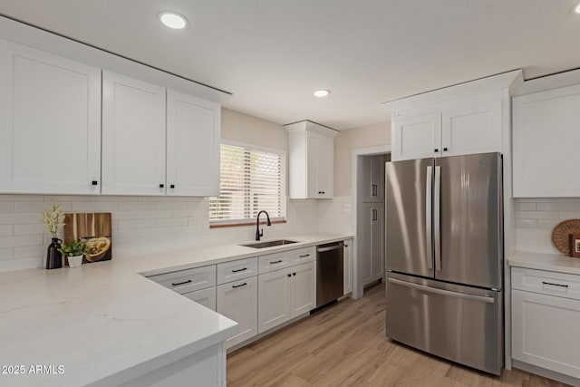 33287 N Windmill Run, San Tan Valley, AZ 85144 - kitchen with stainless steel appliances, a sink, white cabinets, decorative backsplash, and recessed lighting
