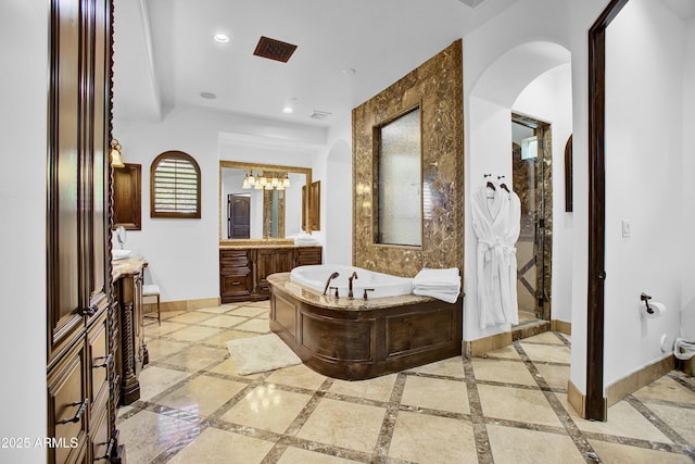 bathroom with visible vents, baseboards, vanity, a bath, and recessed lighting