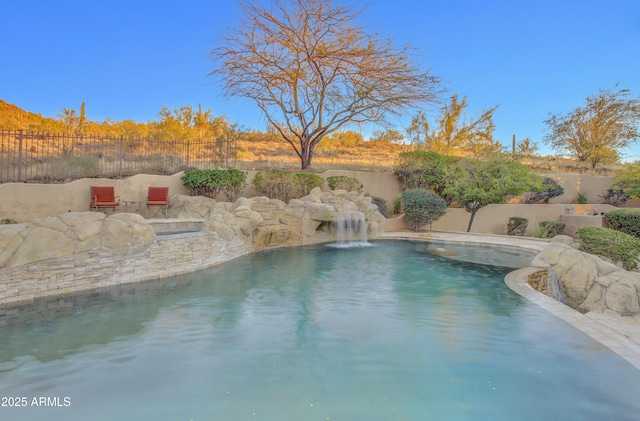 view of pool featuring fence and a fenced in pool