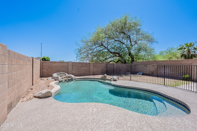 view of swimming pool with a patio area, a fenced in pool, and a fenced backyard