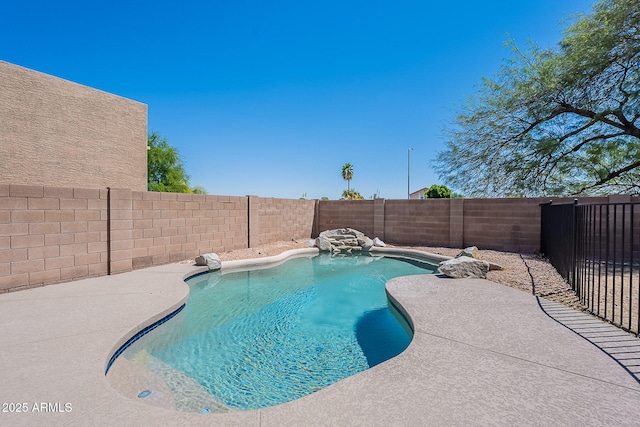 view of swimming pool with a fenced in pool and a fenced backyard