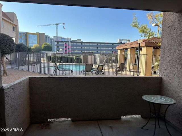 view of patio / terrace featuring a community pool