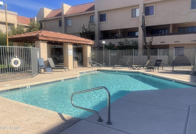 view of swimming pool featuring a patio area