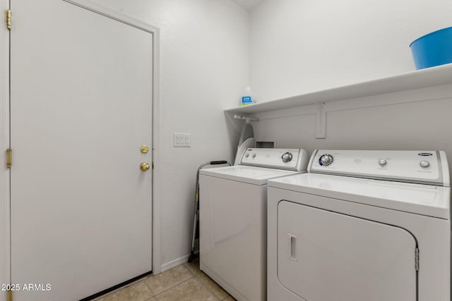 7790 E Bravo Ln, Prescott Valley, AZ 86314 - laundry area with washer and clothes dryer and light tile patterned floors