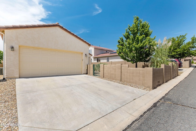 7790 E Bravo Ln, Prescott Valley, AZ 86314 - view of front of house with a garage and stucco siding