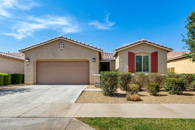 9738 E Tumeric Ave, Mesa, AZ 85212 - mediterranean / spanish home with stucco siding, an attached garage, concrete driveway, and a tile roof