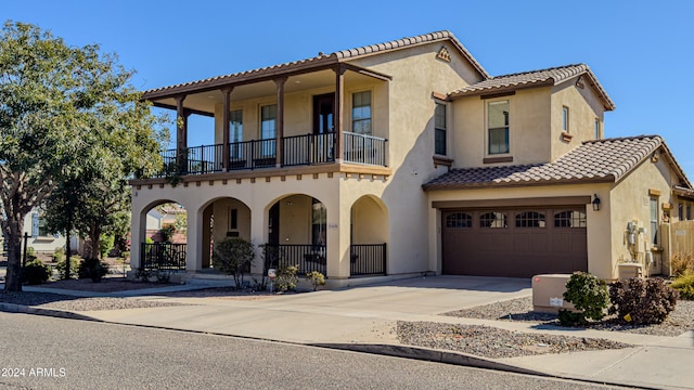 view of front facade with covered porch and a balcony