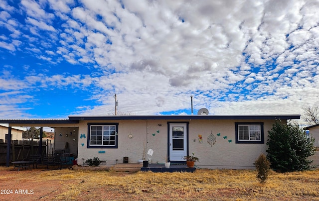 view of front of home featuring a carport