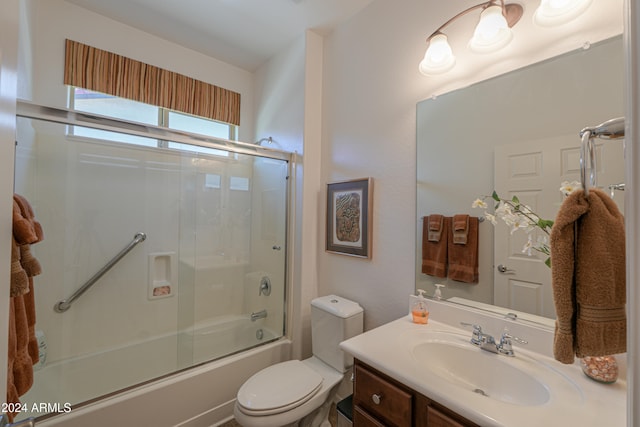 full bathroom featuring vanity, toilet, and enclosed tub / shower combo