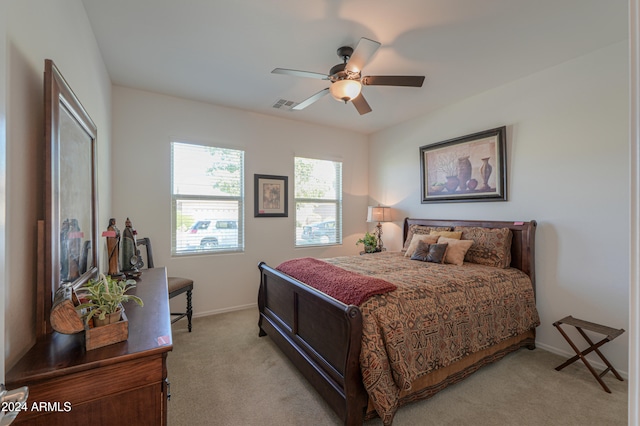 bedroom featuring ceiling fan and light colored carpet