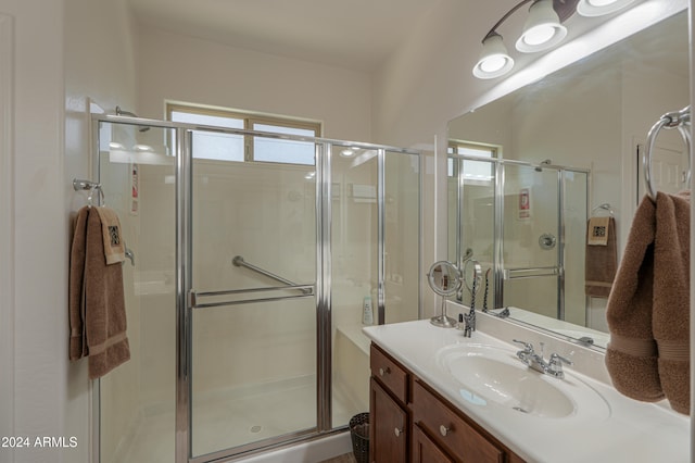 bathroom featuring vanity and walk in shower