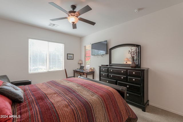 bedroom with light carpet and ceiling fan