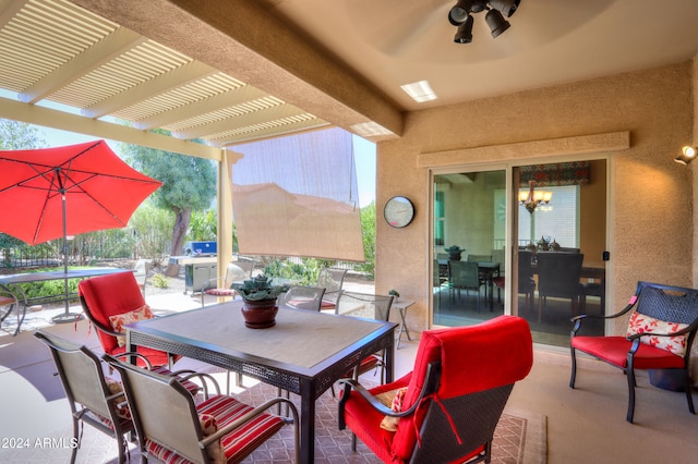 view of patio / terrace with ceiling fan and a pergola