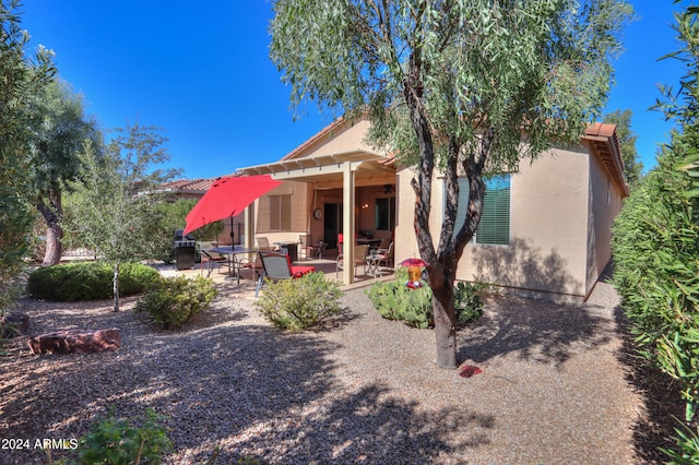 rear view of house with a patio