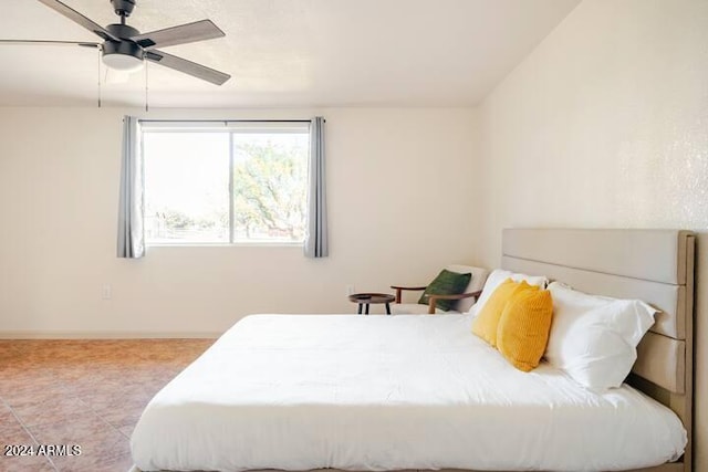 bedroom featuring ceiling fan and light tile patterned floors