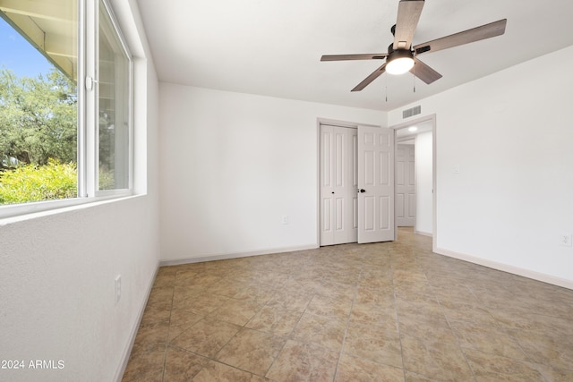 spare room with ceiling fan