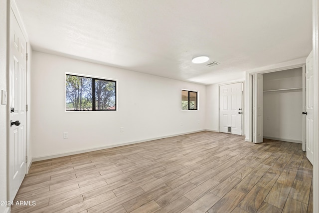 unfurnished bedroom featuring light hardwood / wood-style floors