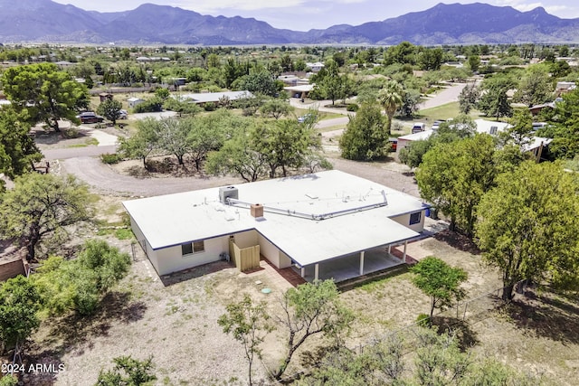 birds eye view of property with a mountain view