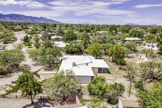 birds eye view of property with a mountain view