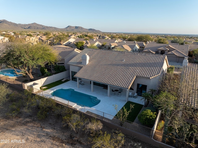 drone / aerial view with a mountain view and a residential view