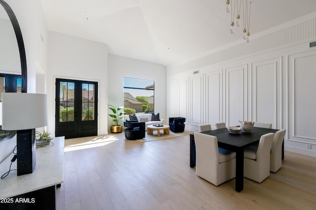 dining room featuring visible vents and light wood-style floors