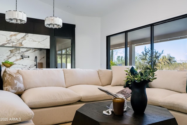 living area with a notable chandelier