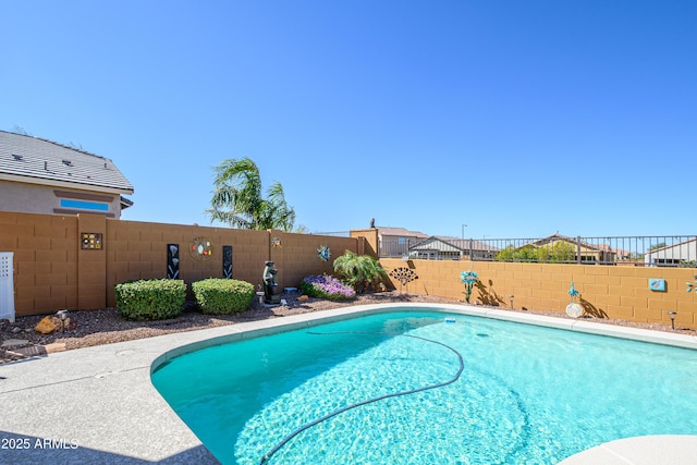 view of swimming pool with a fenced in pool and a fenced backyard