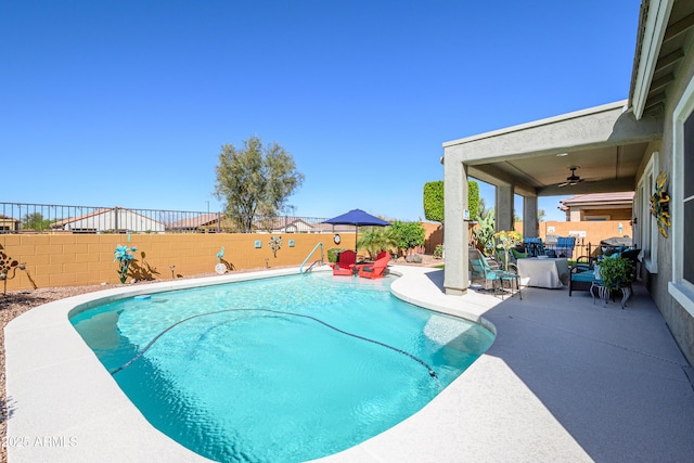 view of pool with ceiling fan, a patio, a fenced backyard, and a fenced in pool