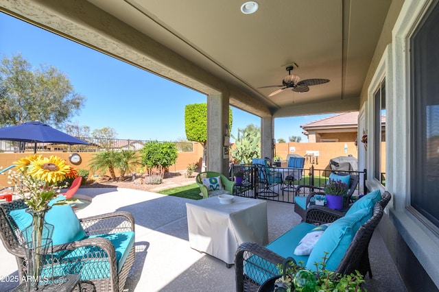 view of patio / terrace with outdoor lounge area, outdoor dining area, a fenced backyard, and a ceiling fan