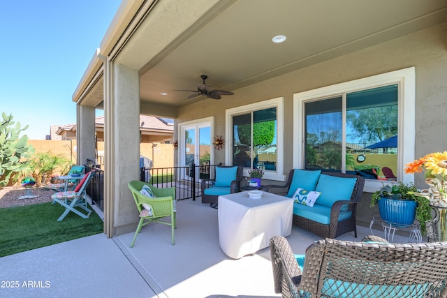 view of patio featuring an outdoor hangout area, ceiling fan, and fence