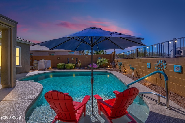 view of pool featuring a patio area, a fenced backyard, and a fenced in pool