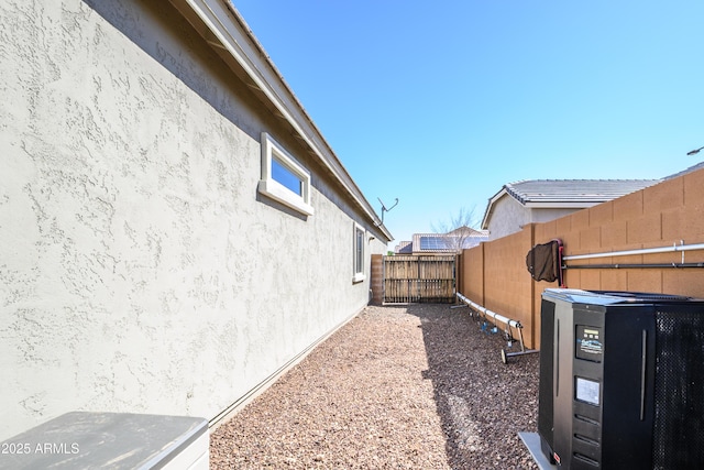 view of yard featuring cooling unit and a fenced backyard