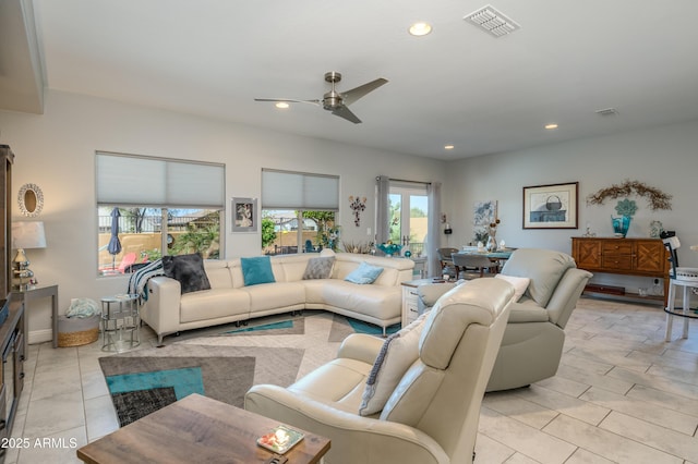 living room featuring light tile patterned floors, visible vents, recessed lighting, and ceiling fan