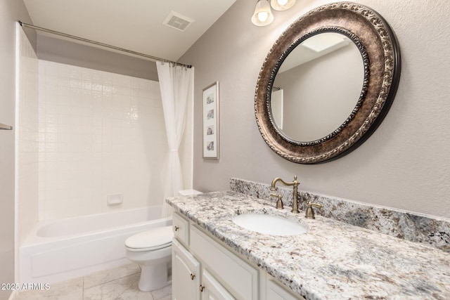 bathroom featuring toilet, vanity, and shower / tub combo