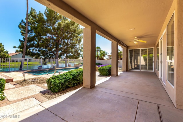 view of patio with a fenced backyard and ceiling fan