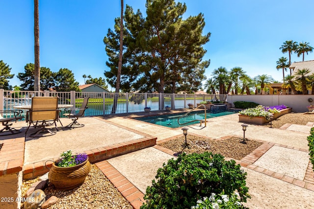 view of pool featuring a patio area and fence